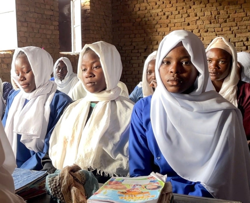 African children sitting in a school in Sudan